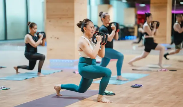 Weighted Mat Pilates Class At Gymnation